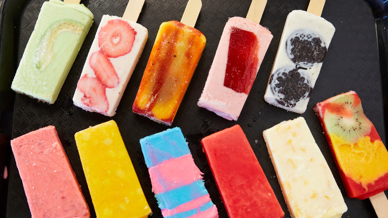 A variety of paletas on a tray
