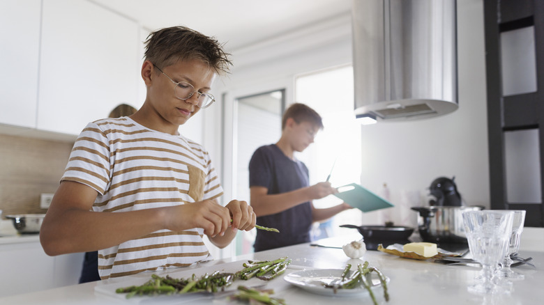 white boy snapping asparagus spears