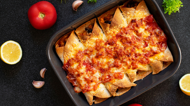 Overcooked enchiladas in a pan