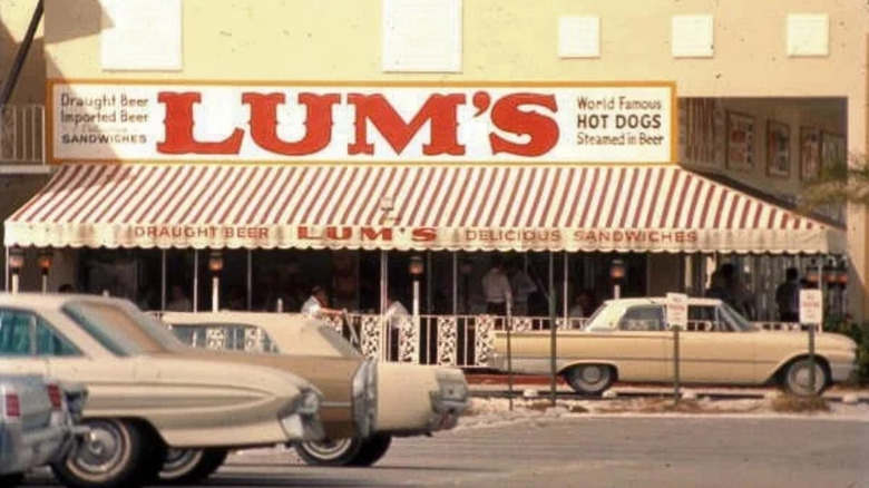 Red and white awning and sign exterior of Lum's