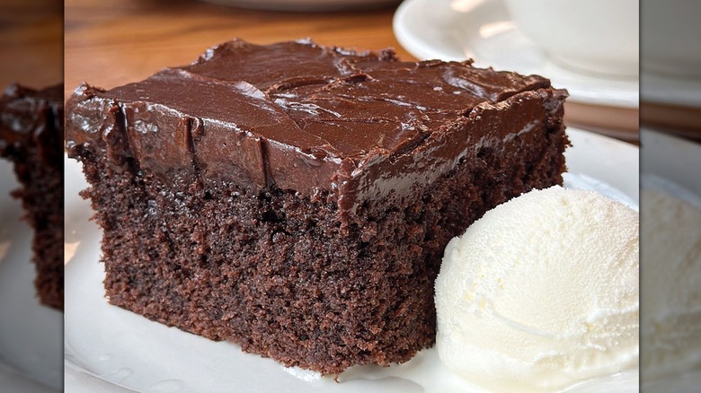 A plate with chocolate cake and vanilla ice cream