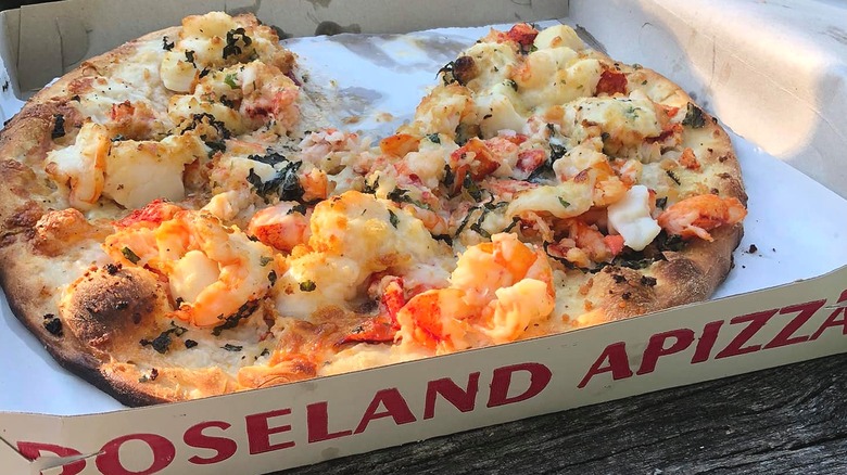Seafood pizza in pizza box