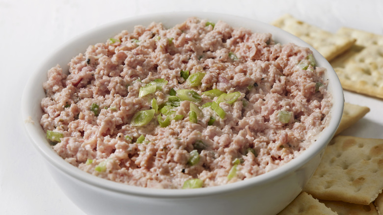 Deviled ham in a bowl with saltine crackers