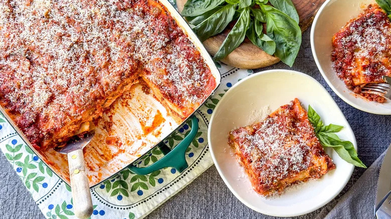 Casserole dish of Cottage Cheese Lasagna with two individual portions on small plates