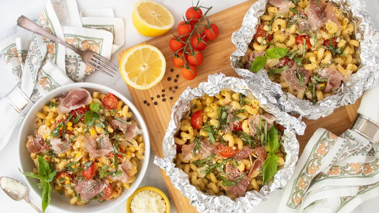 Portions of Foil Packet Summer Pasta with proscuitto, lemon, and cherry tomatoes