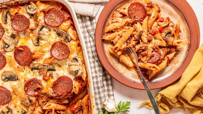 Casserole dish and bowl full of Pepperoni and Mushroom Pizza Pasta