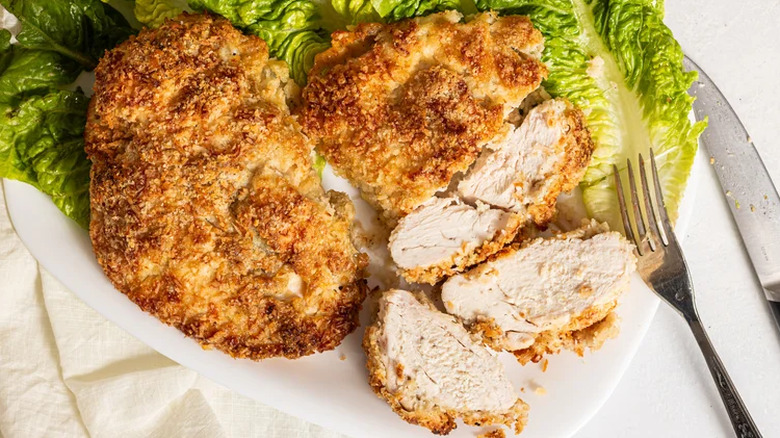 Crispy coconut baked chicken breasts served on a bed of lettuce