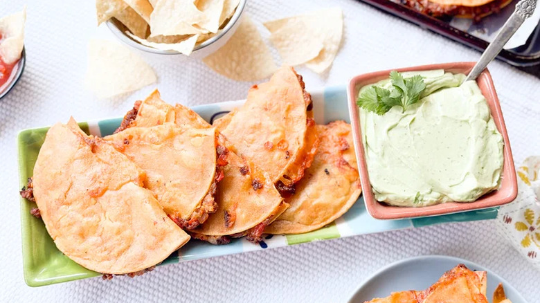 Plate of tacos with sauce