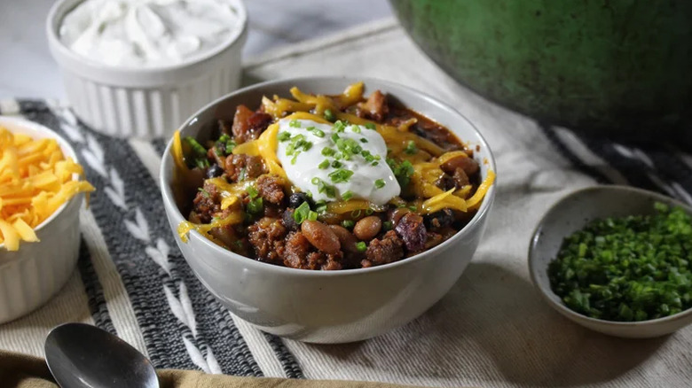 Chili in a bowl with toppings