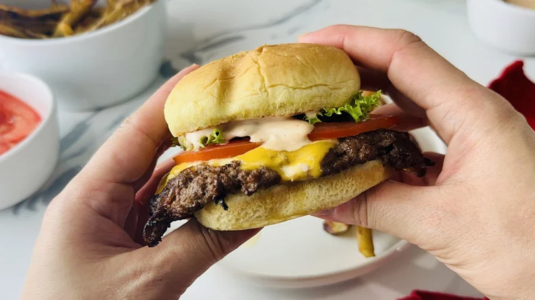Smash burger in hands