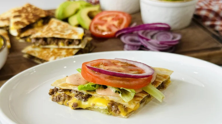 Loaded cheeseburger quesadillas on plate