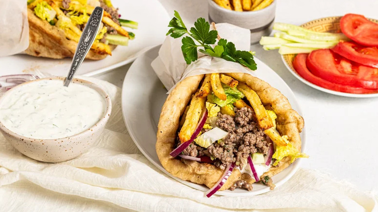 Ground beef gyros with sauce and toppings