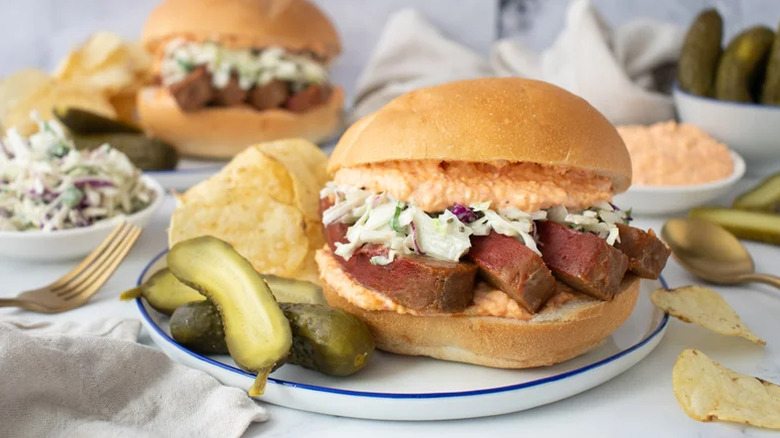 Sandwich with pickles, chips, and pimento cheese