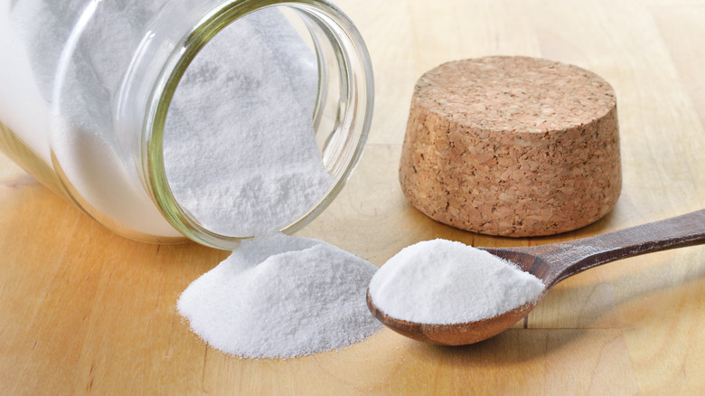 baking powder spilling from jar