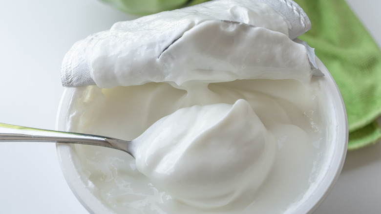 Greek yogurt container and spoon