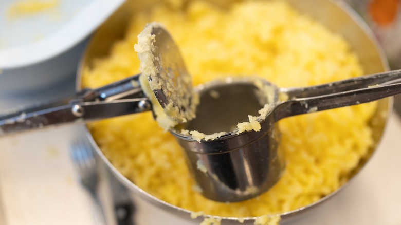potato ricer mashing potatoes