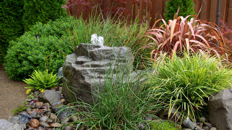 Rock-shaped water feature in a garden