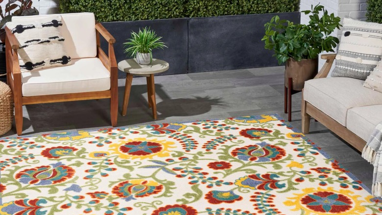 Brightly patterned rug on outdoor patio