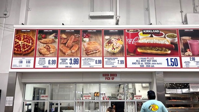 Cafeteria counter with menu board inside Costco