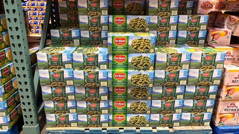 Bulk-sized boxes of green beans on display inside Costco