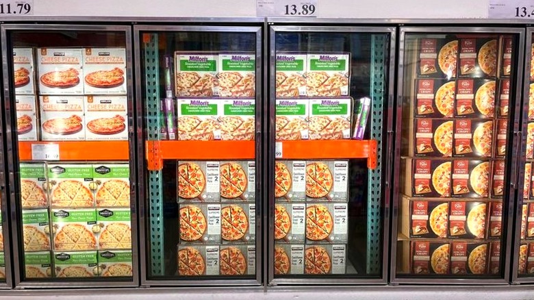 Frozen pizzas on display inside Costco