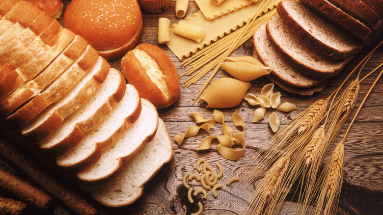 Arrangement of grains and carbohydrates on wooden table