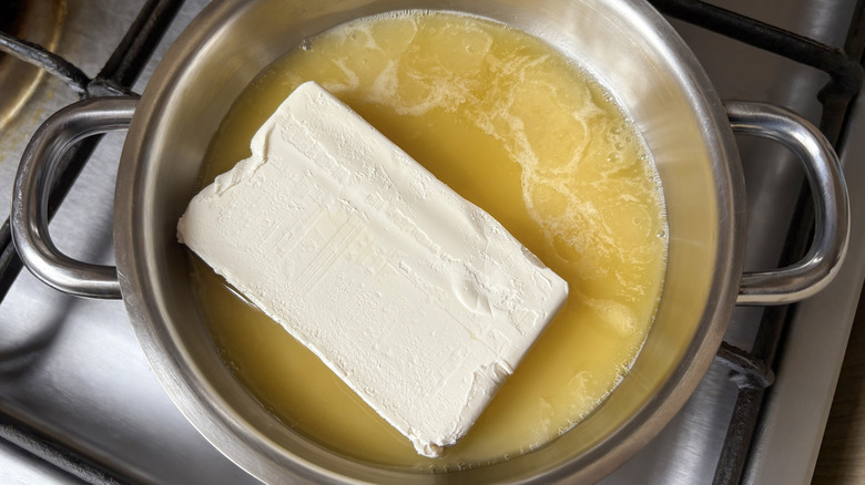 Butter melting in a pot on the stove