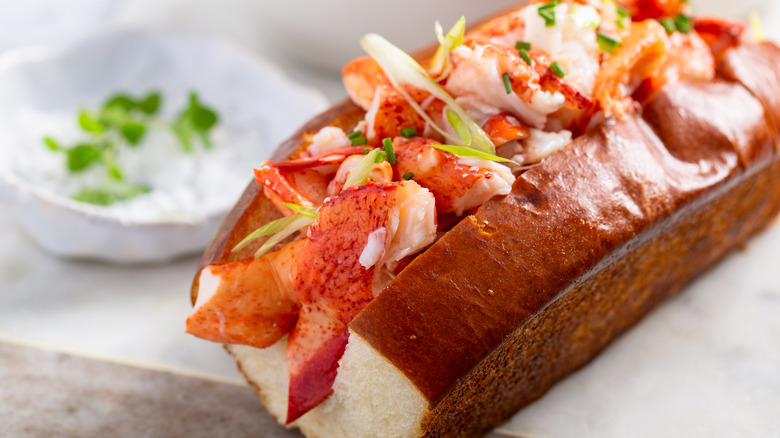 A lobster roll with a brioche bun