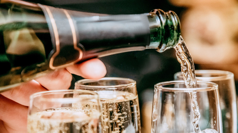 Pouring Champagne into glasses