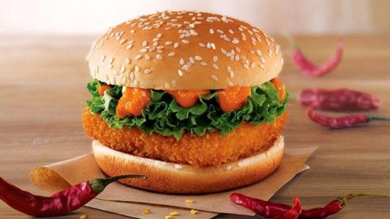 McSpicy Paneer on a table with artfully scattered dried peppers