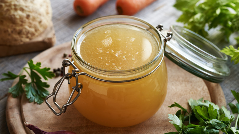 Container of chicken broth