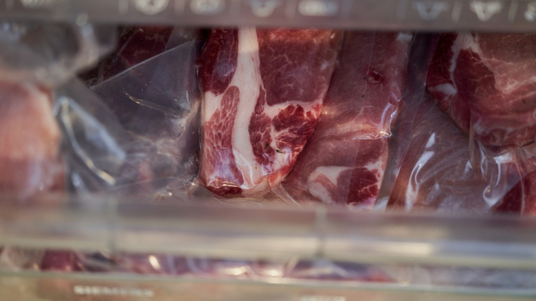 Vacuum-sealed meat in freezer