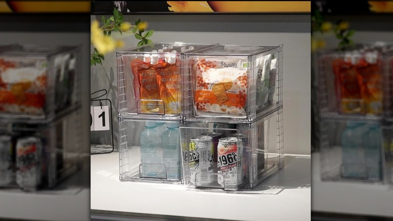 Stackable bins with snacks and drinks inside
