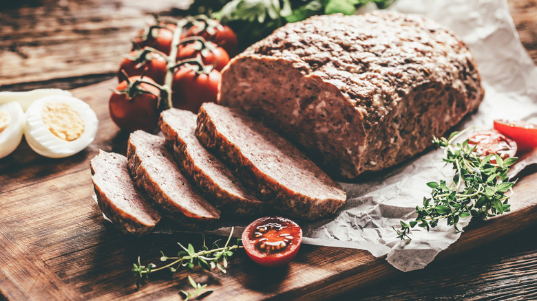 Sliced meatloaf on a cutting board
