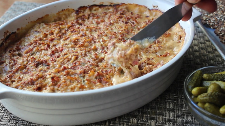 Knife in a bowl of Reuben dip