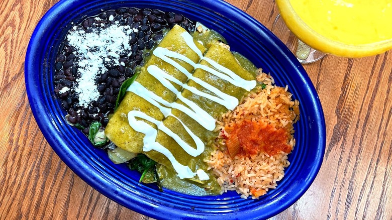 A plate of enchiladas with beans and rice at Pancho's