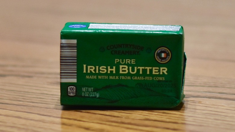 A package of pure Irish butter on a wooden table