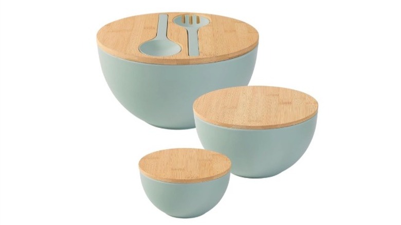Salad bowl set with built in utensils and lids.