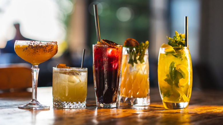 A variety of cocktails on a bar