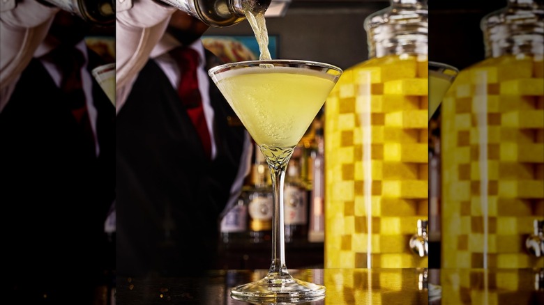 A bartender pouring The Doli cocktail at The Capital Grille