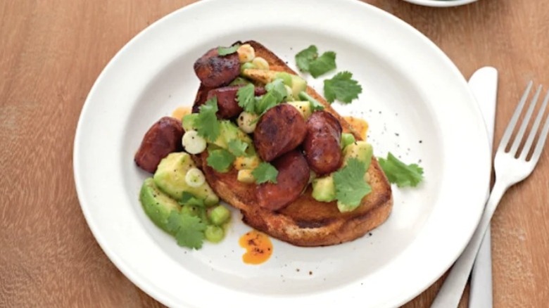 Avocado and chorizo toast topped with cilantro