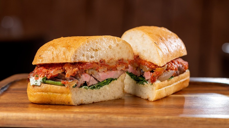 A sandwich on a wooden tray at the Grand Canal Shoppes