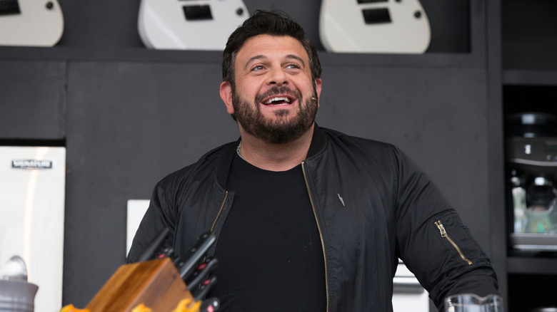 Adam Richman speaking at a food festival event