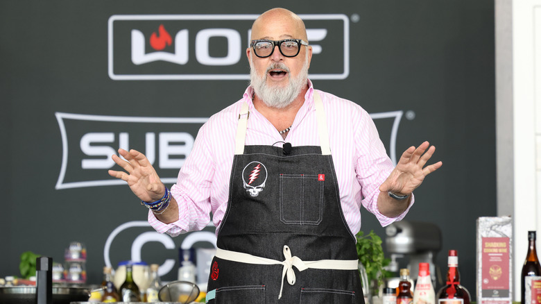 Andrew Zimmern speaking at a food festival