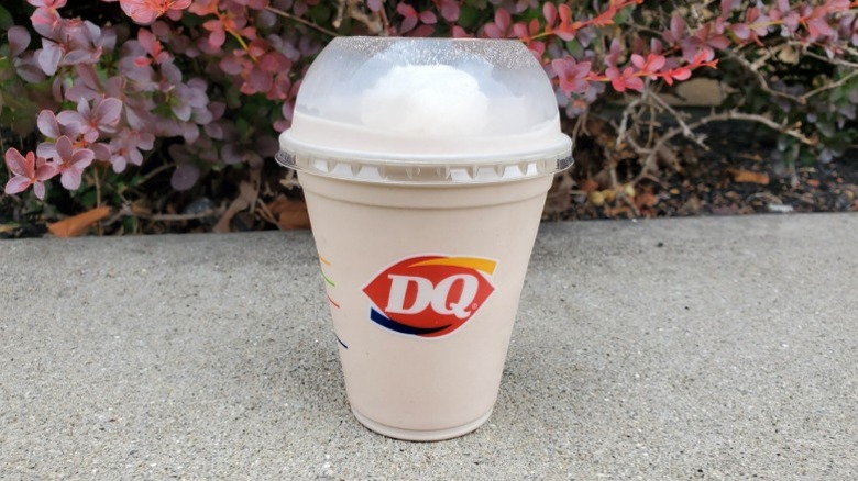 Dairy Queen chocolate milkshake with floral background