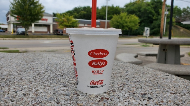 Rally's chocolate shake on stone table outside