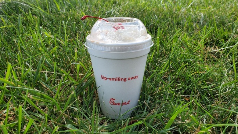 Chick-fil-A chocolate milkshake in grass