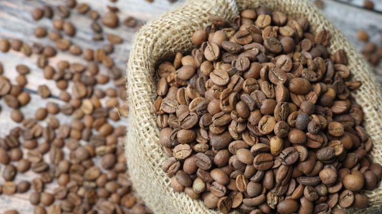 coffee beans spilling out of a burlap sack