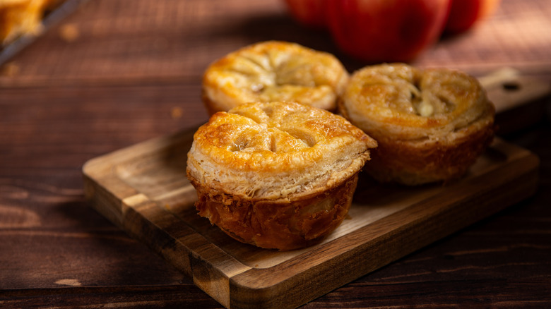 rustic fruit pies on a wooden serving board