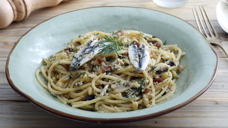 Close up of sardine pasta in white bowl